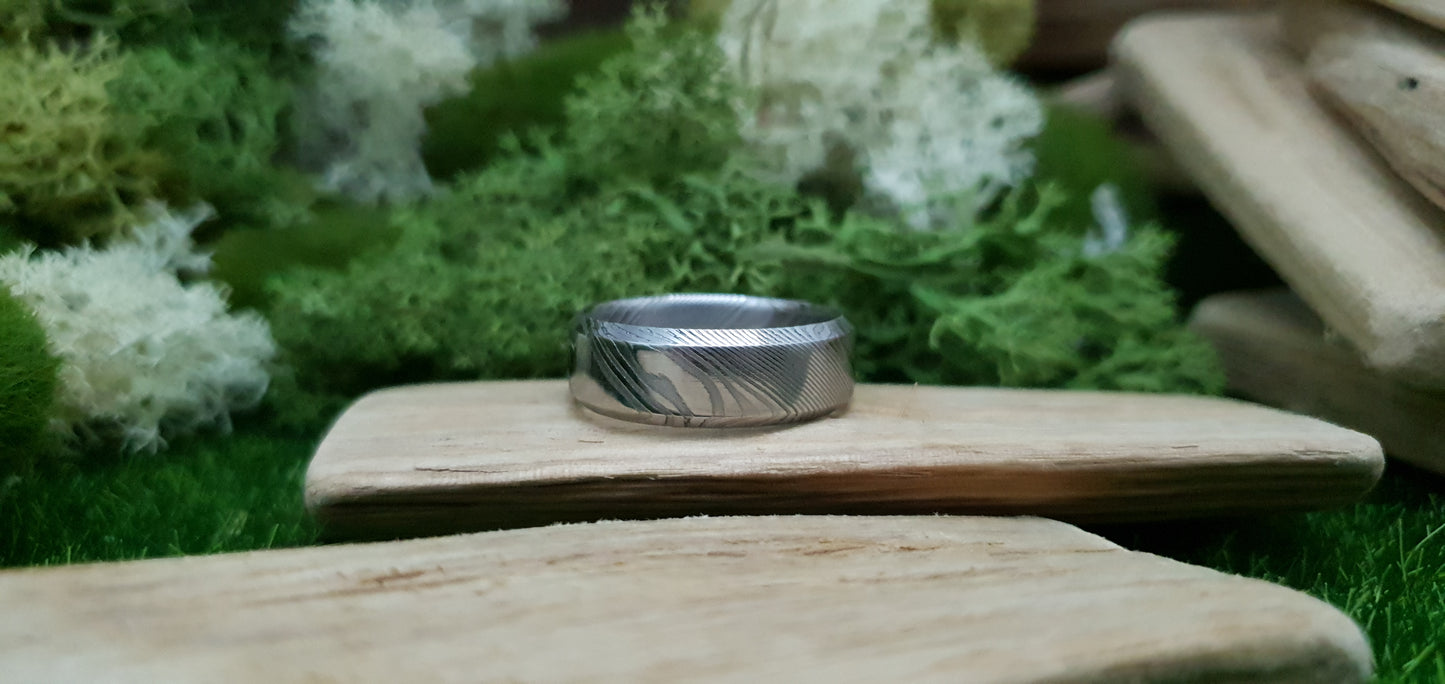 Handmade Damascus steel ring with bevel shape and distinctive finish