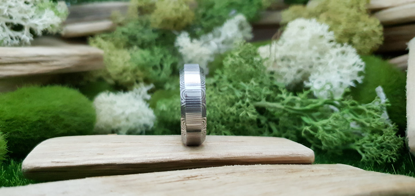 Unique handcrafted Damascus steel ring with bevelled edges