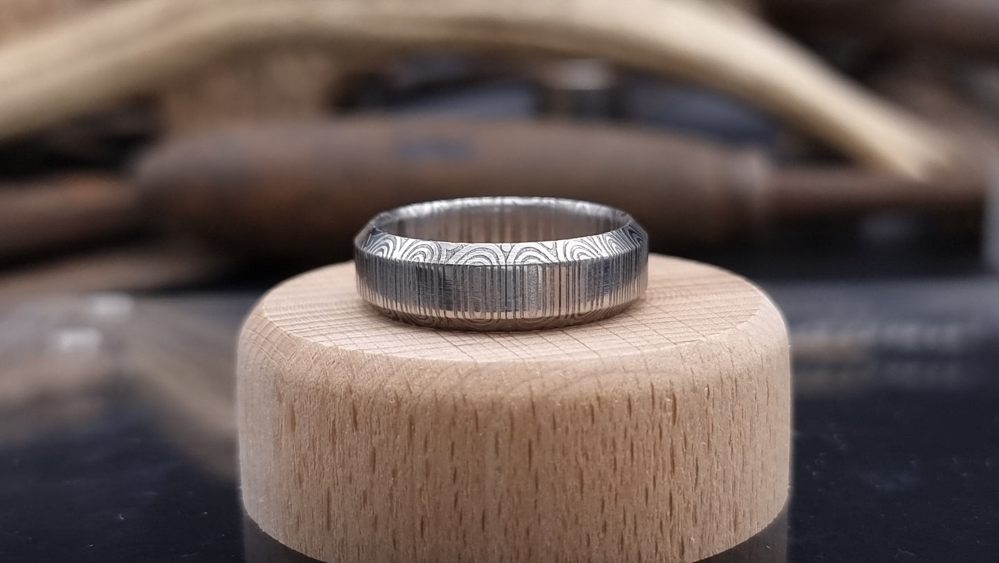 Unique handcrafted Damascus steel ring with bevelled edges