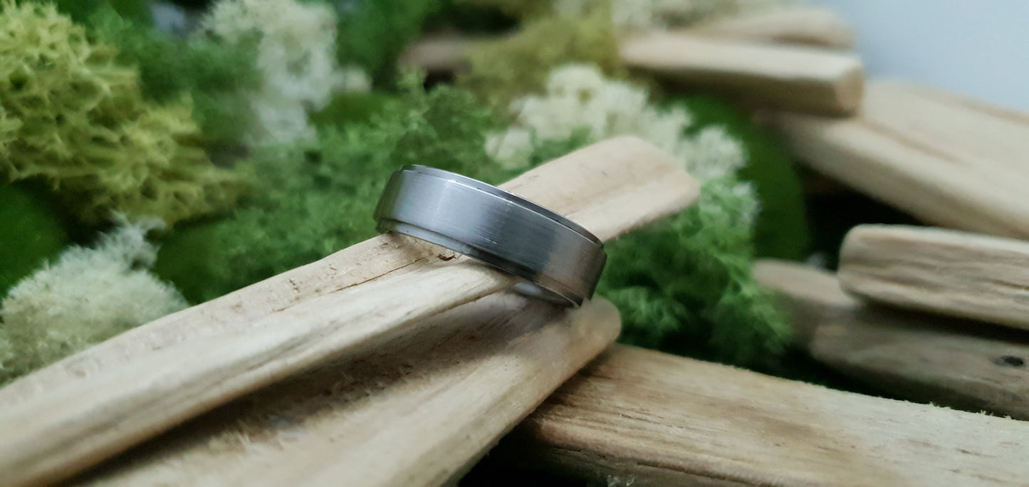 Smooth satin titanium wedding band for men in minimalist design