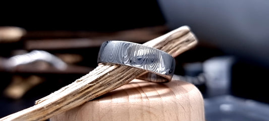 Dee Damascus steel court shaped ring with layered forged pattern