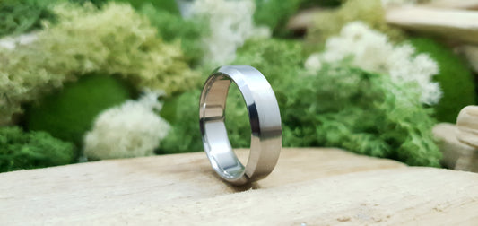 Handmade titanium ring with matte brushed texture and bevelled design