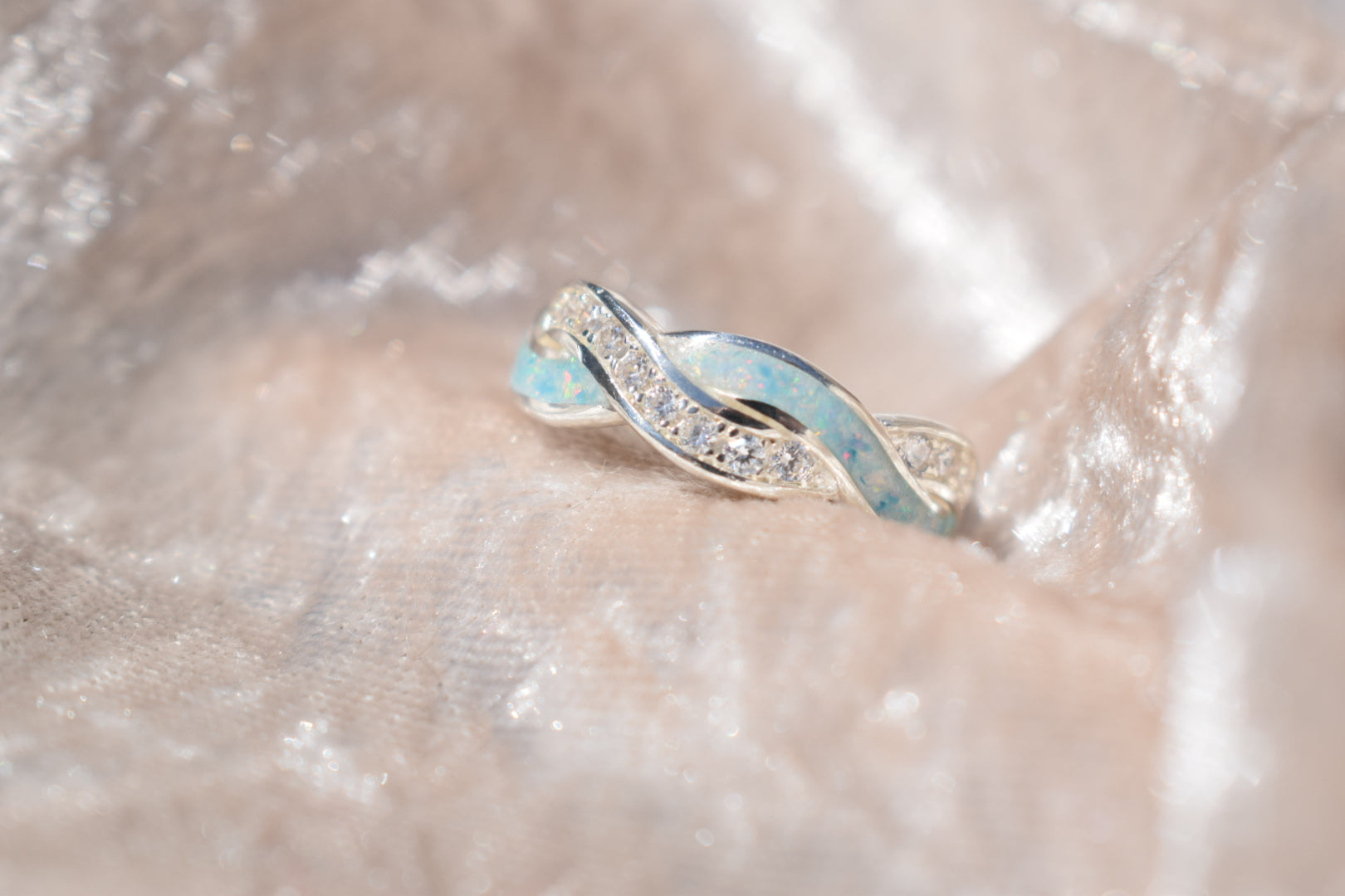 Entwined silver memorial ring with CZ stones and hidden ashes compartment