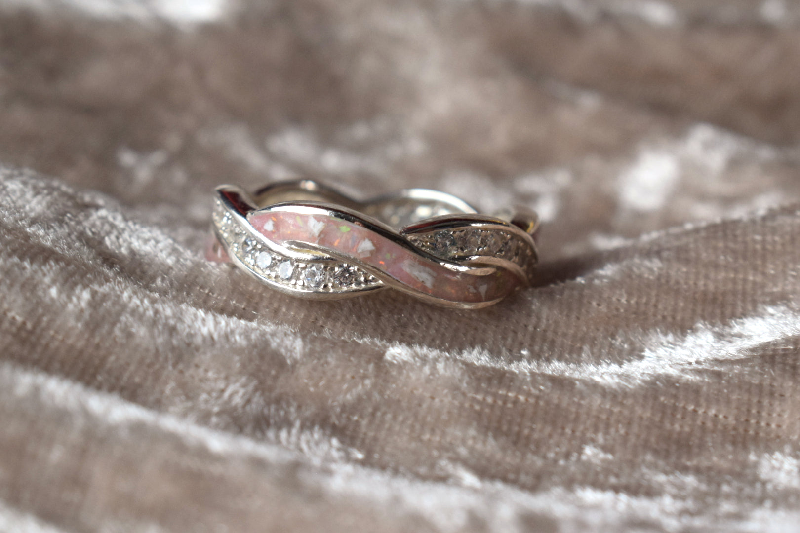 Entwined silver memorial ring with CZ stones and hidden ashes compartment