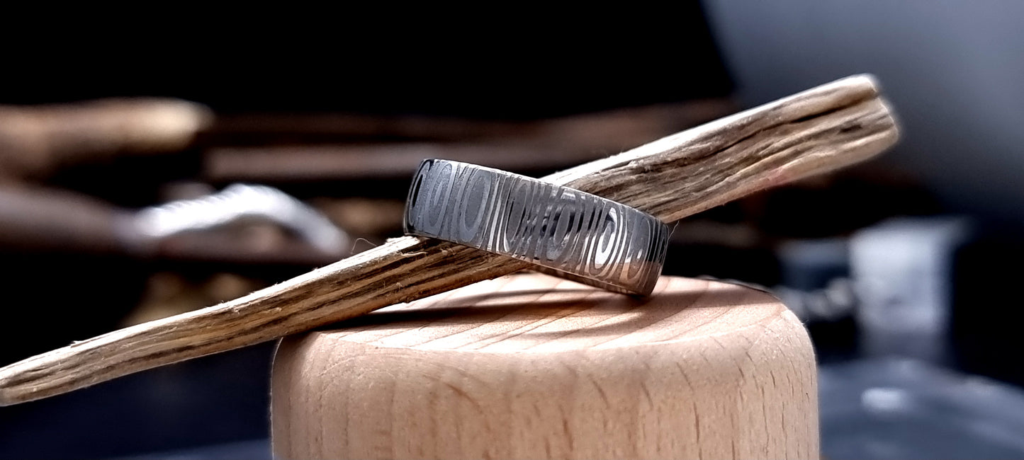Unique men’s wedding ring in Cowie patterned Damascus steel