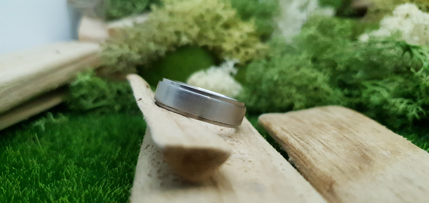 Smooth satin titanium wedding band for men in minimalist design