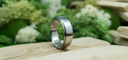 Sleek and modern titanium band with mirror finish and comfort fit