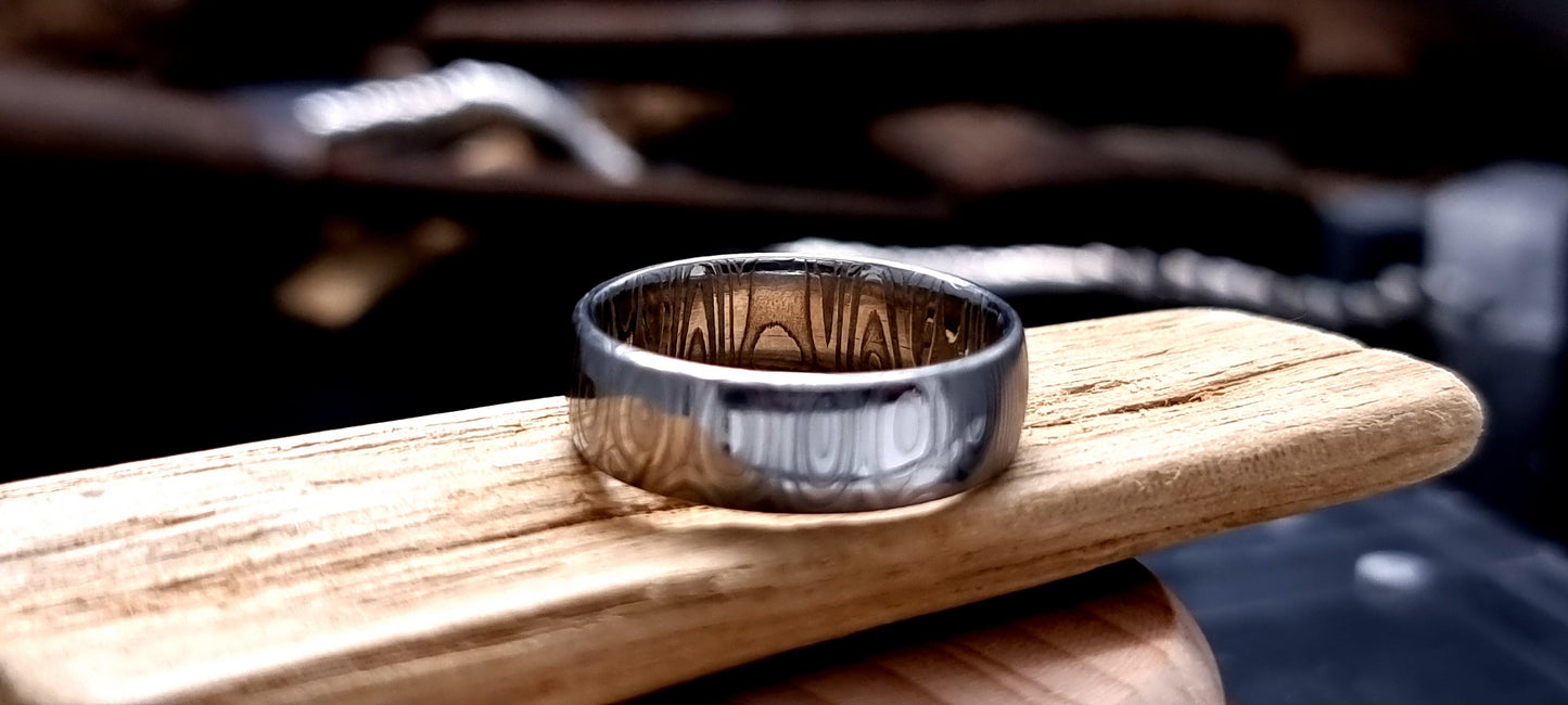 Dee Damascus steel court shaped ring with layered forged pattern