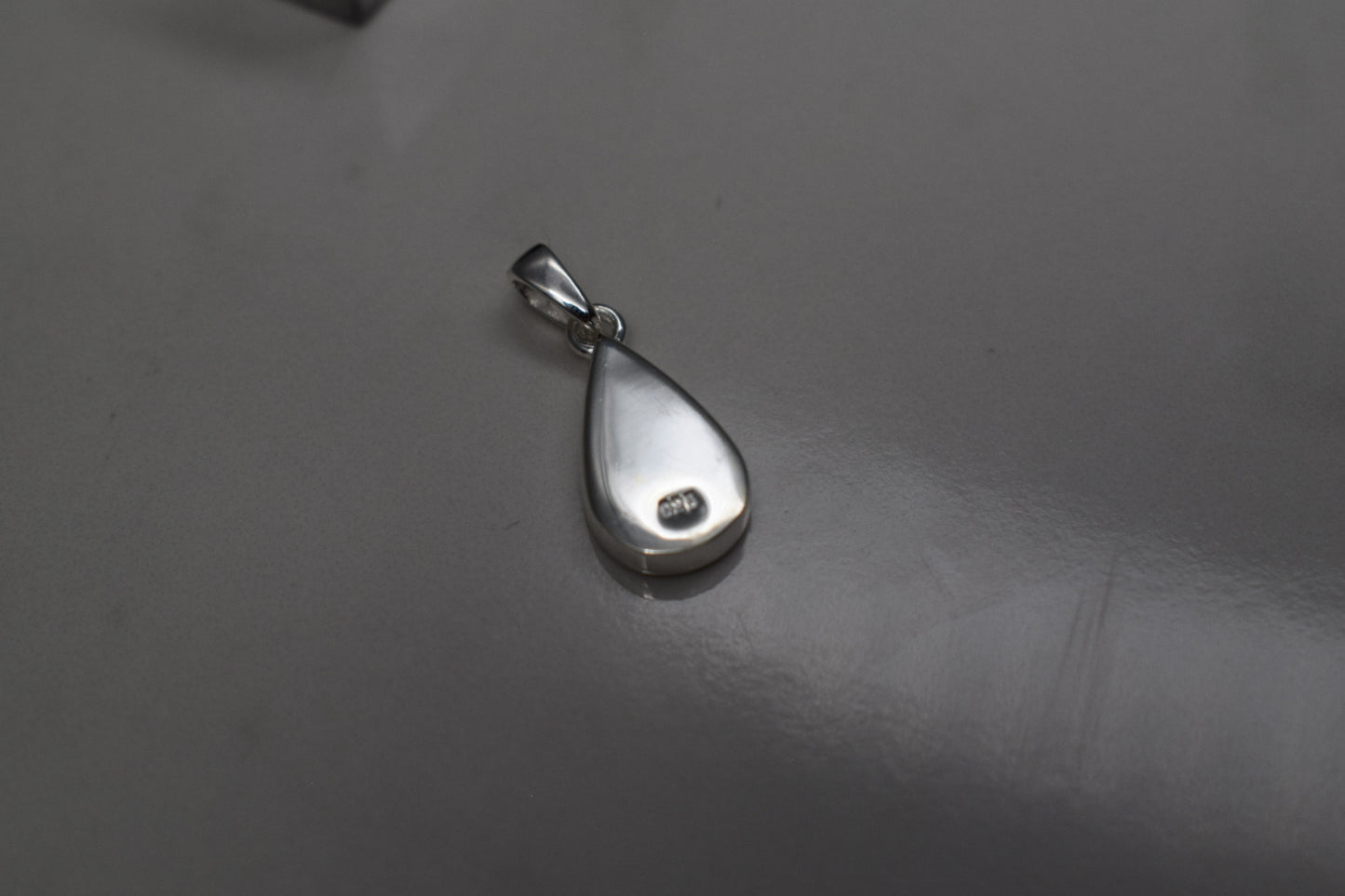 Handmade teardrop silver memorial ashes necklace with discreet ashes inlay, crafted in the UK