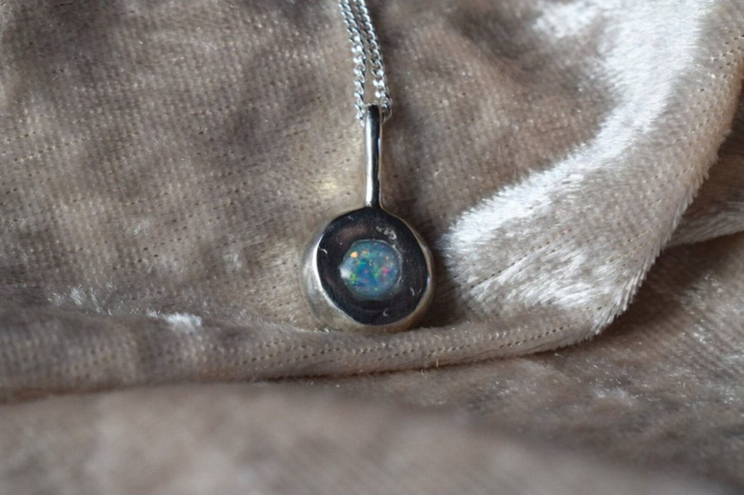 Silver nugget-shaped ashes necklace with hidden memorial compartmen