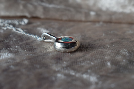 Silver nugget-shaped ashes necklace with hidden memorial compartmen