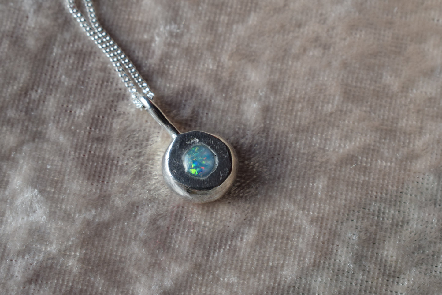 Silver nugget-shaped ashes necklace with hidden memorial compartmen