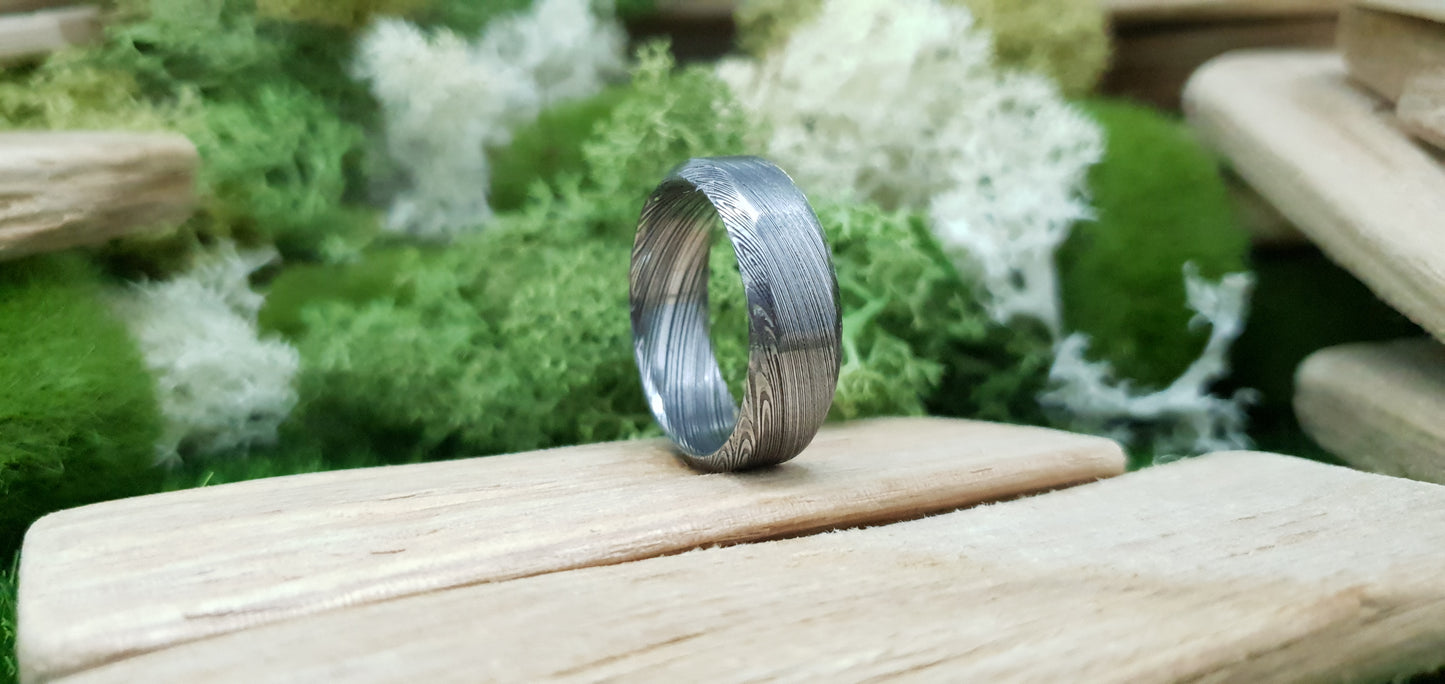 Unique Bervie patterned Damascus ring crafted for alternative weddings