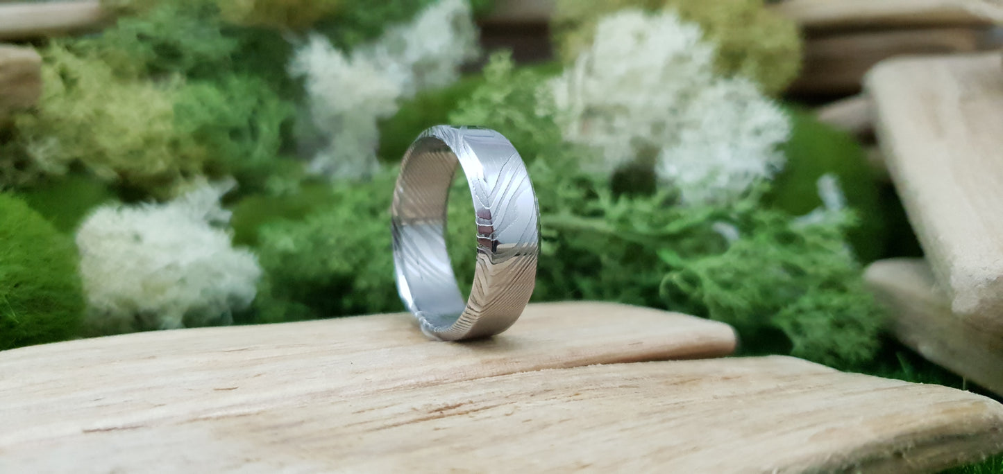 Handmade Damascus steel ring with bevel shape and distinctive finish
