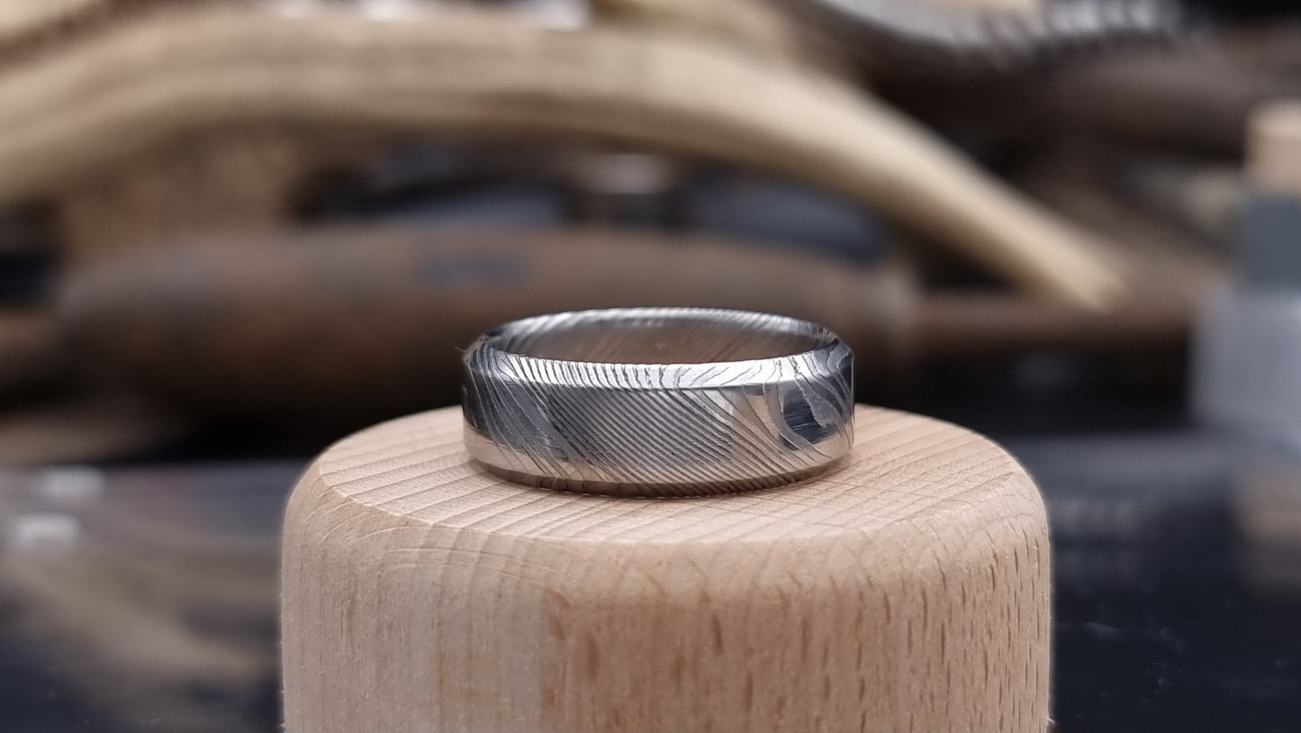 Handmade Damascus steel ring with bevel shape and distinctive finish
