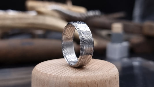 Handmade Damascus steel ring with bevel shape and distinctive finish