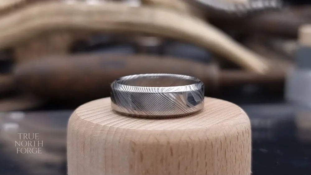Handmade Damascus steel ring with bevel shape and distinctive finish