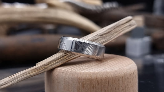 Handmade Damascus steel ring with bevel shape and distinctive finish
