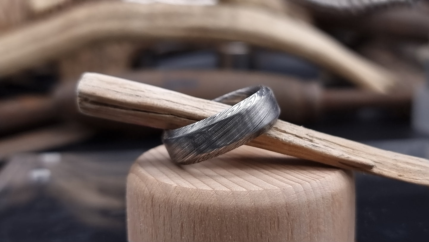 Unique Bervie patterned Damascus ring crafted for alternative weddings
