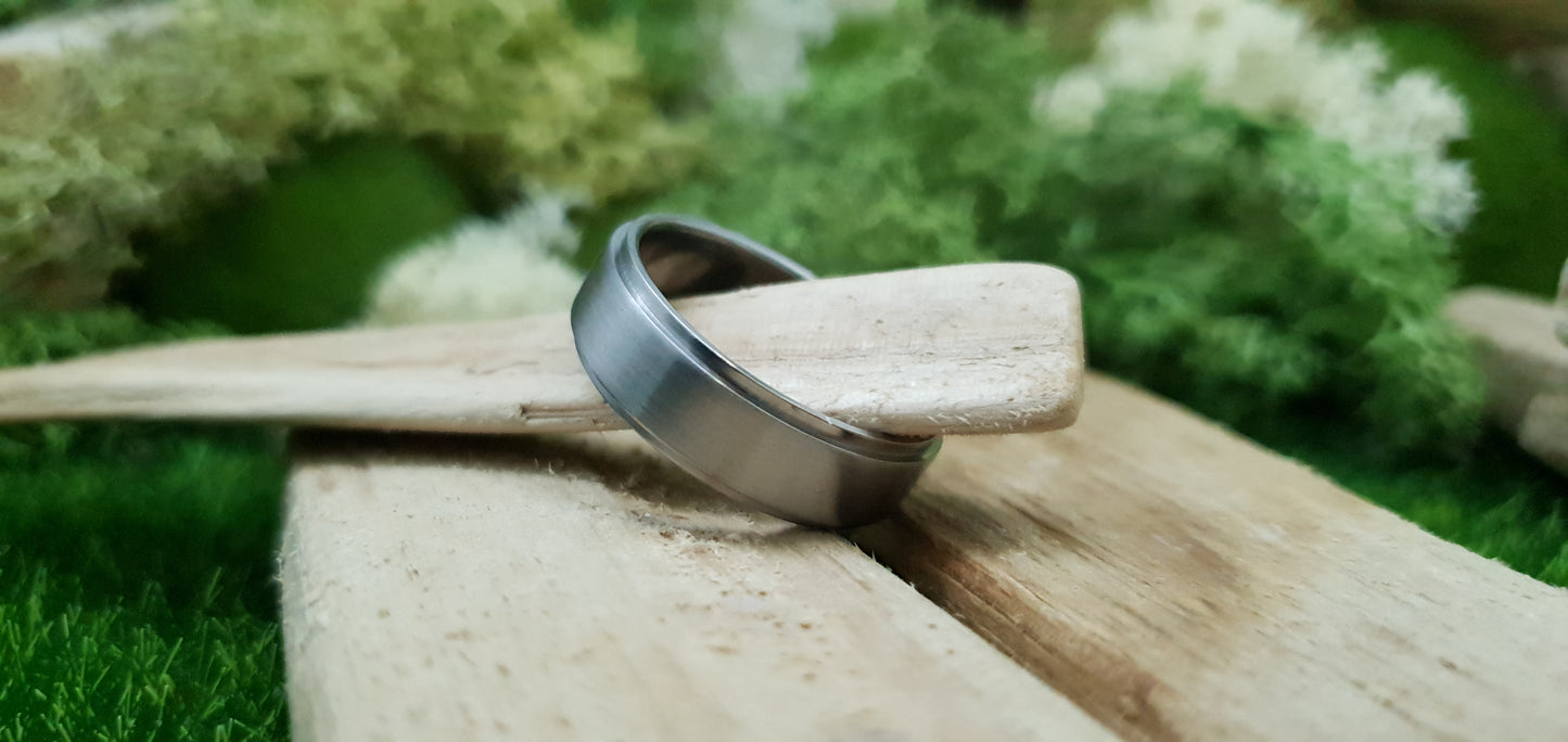 Smooth satin titanium wedding band for men in minimalist design