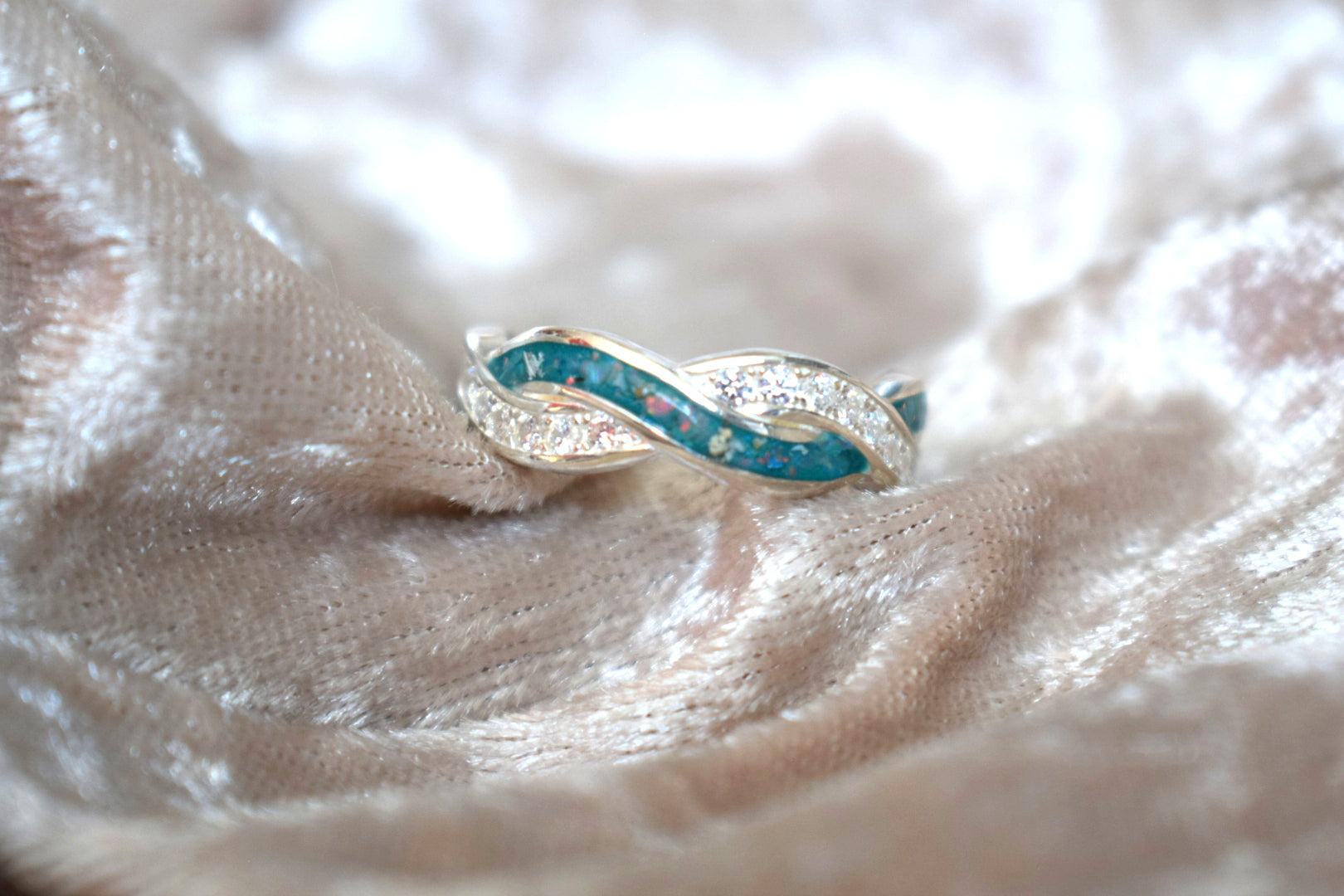 Entwined silver memorial ring with CZ stones and hidden ashes compartment
