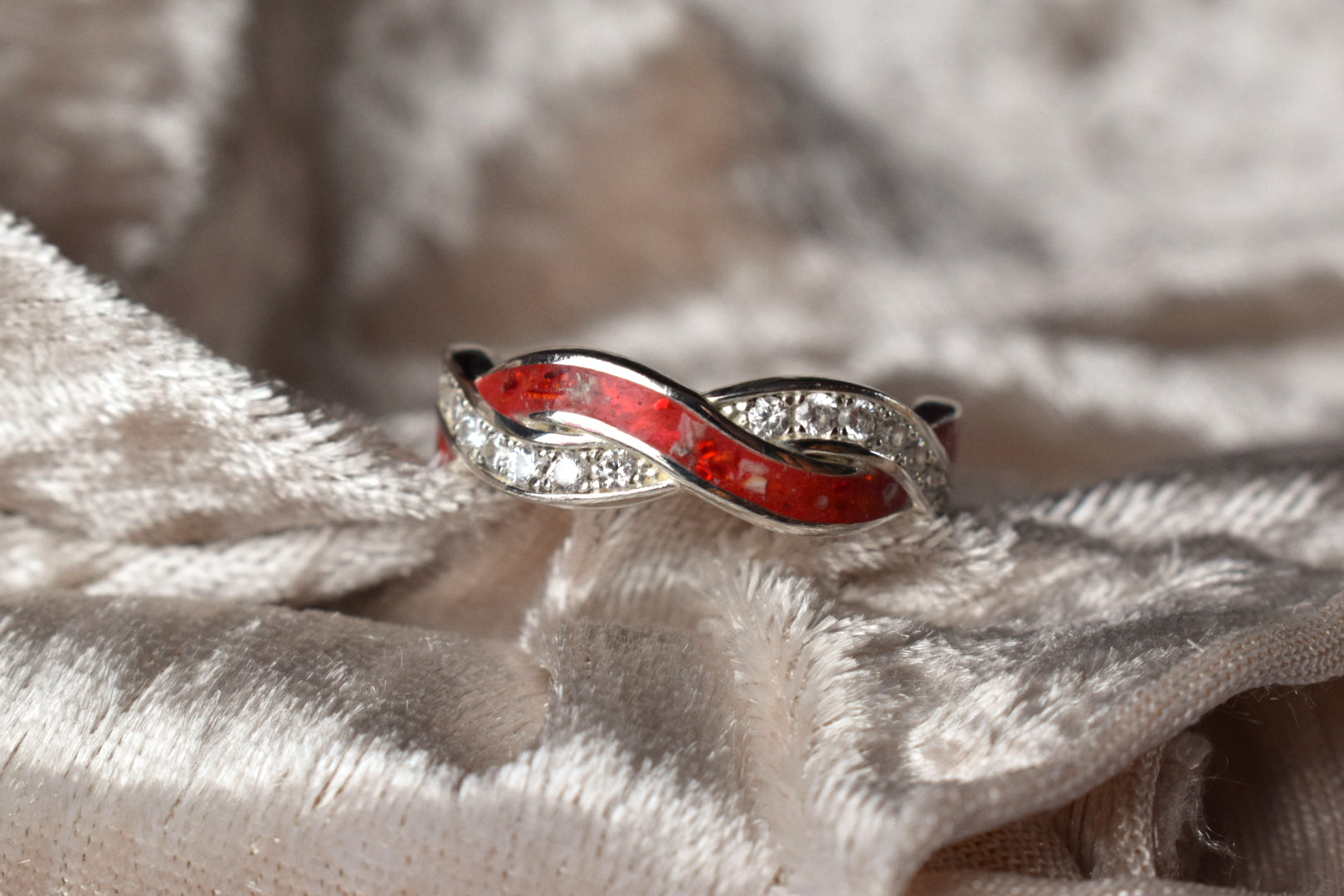 Entwined silver memorial ring with CZ stones and hidden ashes compartment