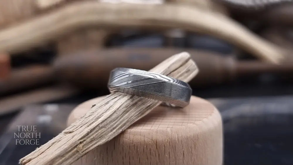 Unique men’s Damascus steel ring featuring Esk patterned layers