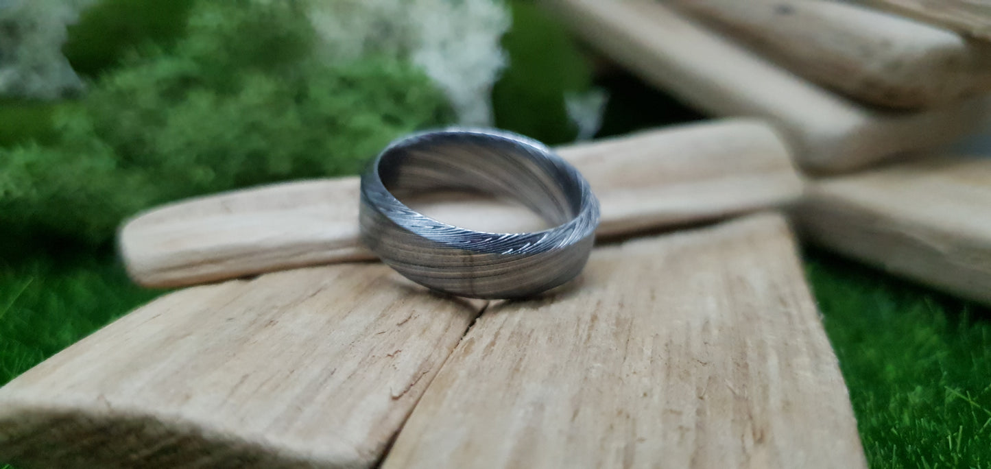 Unique Bervie patterned Damascus ring crafted for alternative weddings