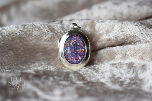 Sterling silver memorial locket necklace with classic oval design