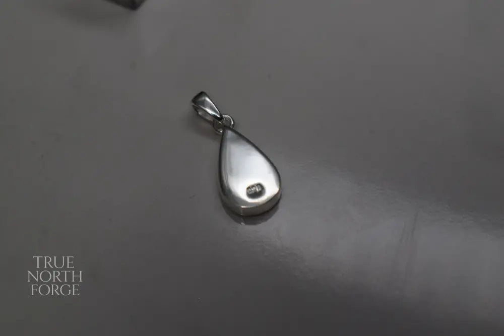 Handmade teardrop silver memorial ashes necklace with discreet ashes inlay, crafted in the UK