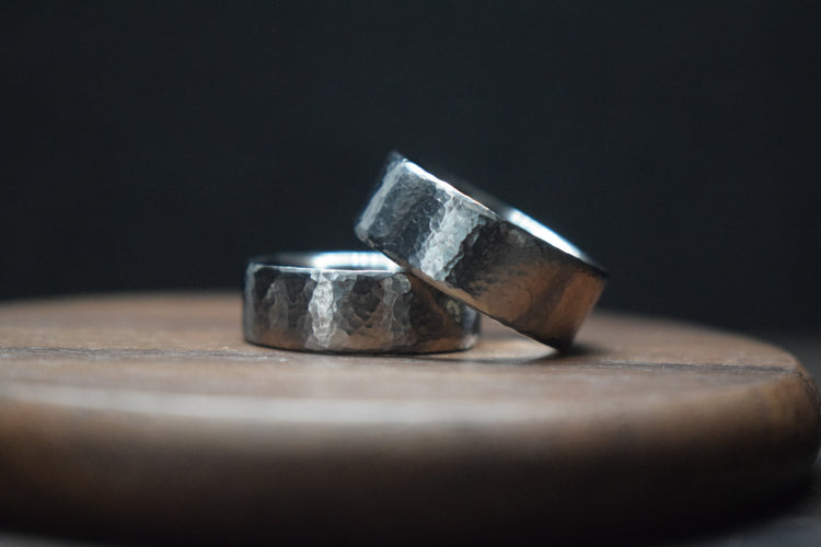Hammered titanium and black zirconium wedding rings from the Deveron collection