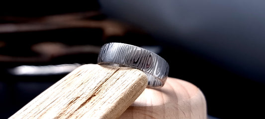 Unique men’s wedding ring in Cowie patterned Damascus steel