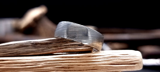 Court-shaped Damascus steel ring for men with rustic etched finish
