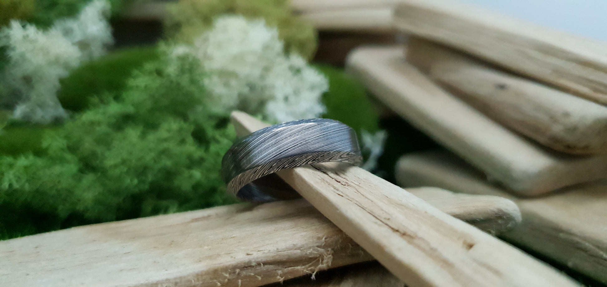Unique Bervie patterned Damascus ring crafted for alternative weddings