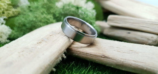 Smooth satin titanium wedding band for men in minimalist design