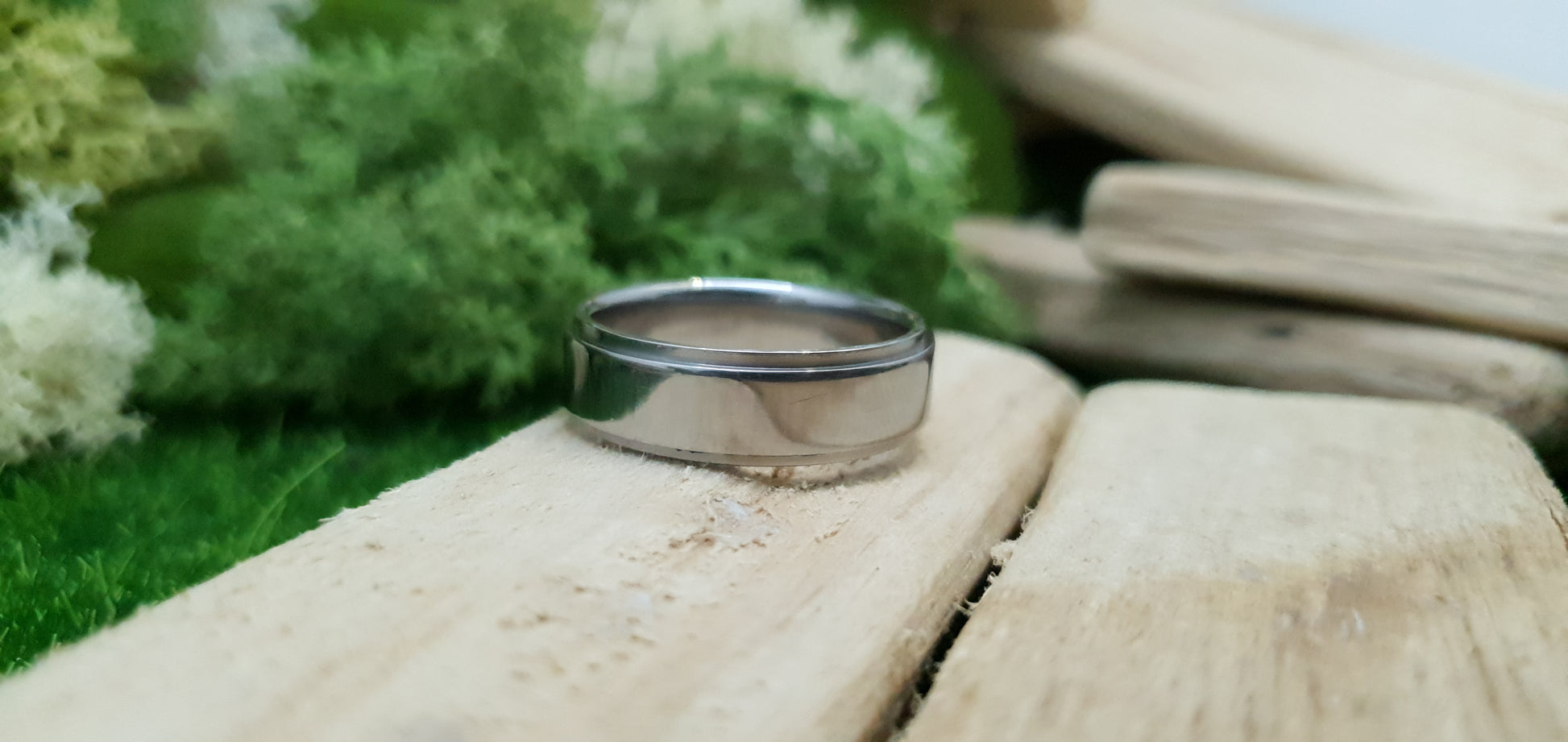Sleek and modern titanium band with mirror finish and comfort fit