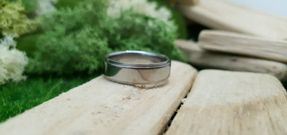 Sleek and modern titanium band with mirror finish and comfort fit