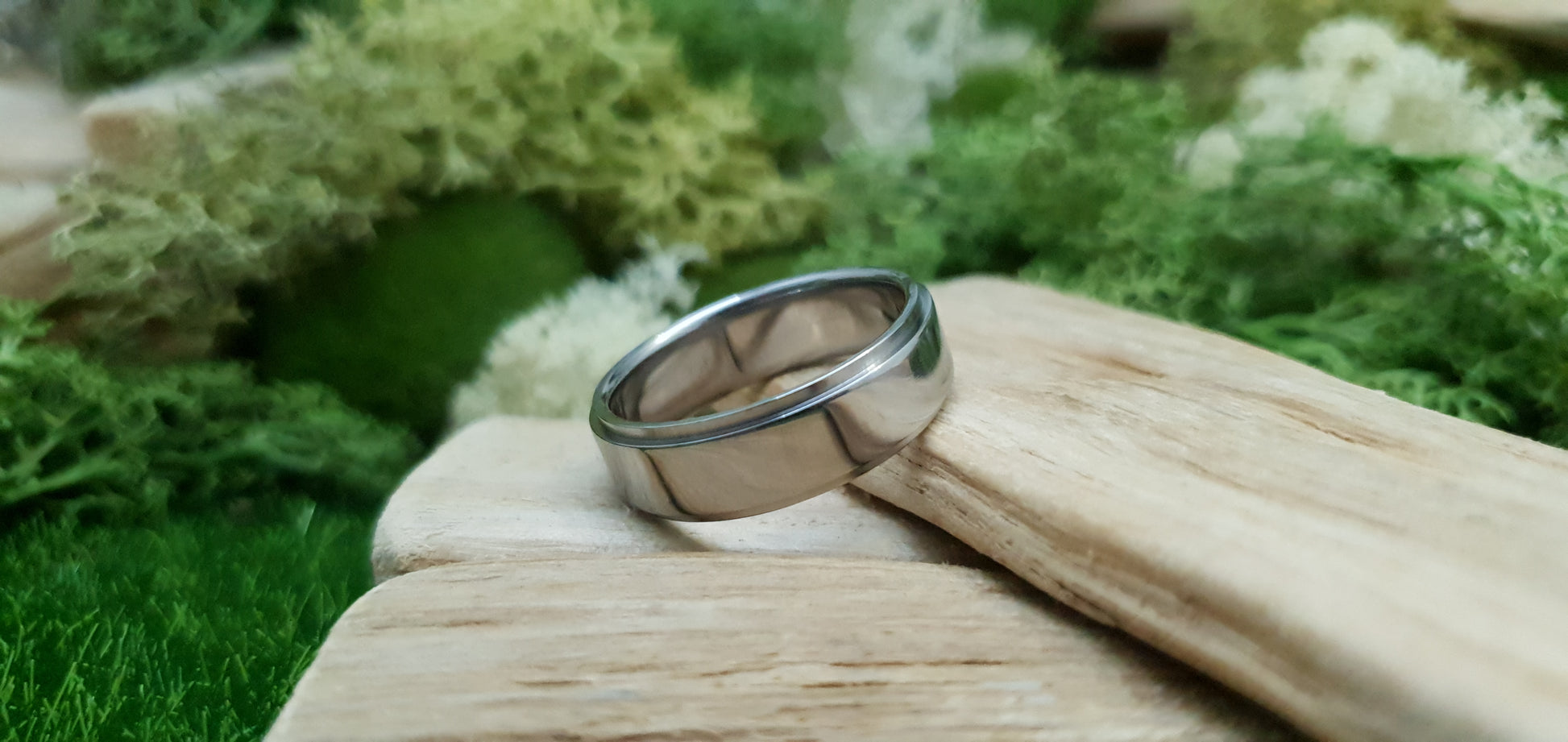 Sleek and modern titanium band with mirror finish and comfort fit