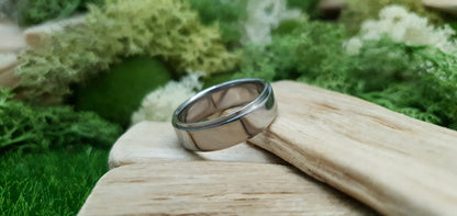 Sleek and modern titanium band with mirror finish and comfort fit