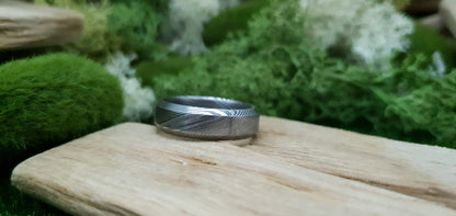 Unique men’s Damascus steel ring featuring Esk patterned layers