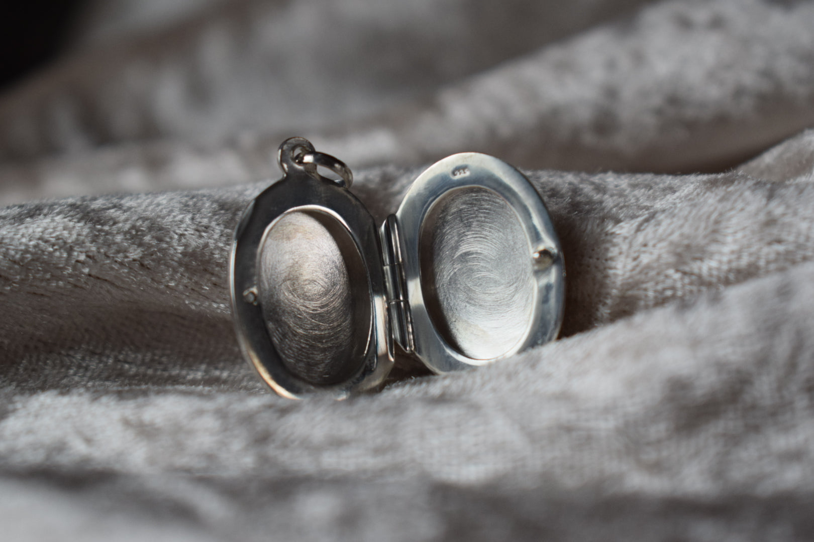 Sterling silver memorial locket necklace with classic oval design