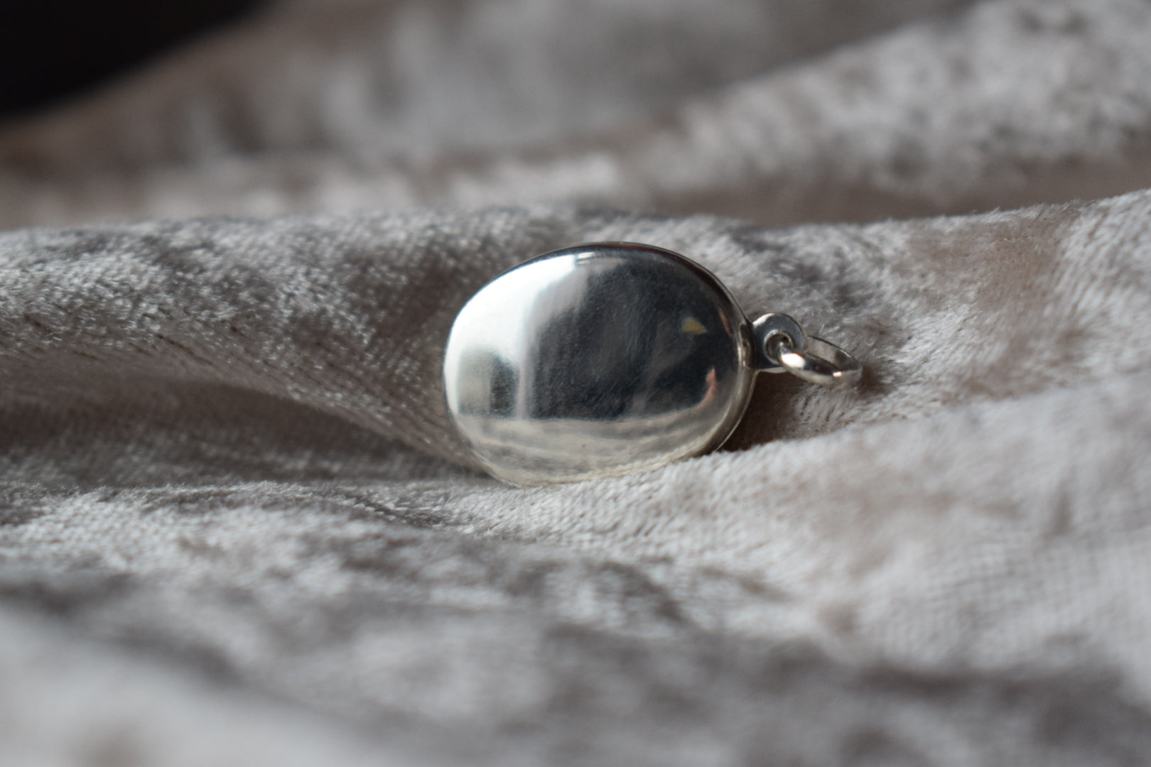 Sterling silver memorial locket necklace with classic oval design