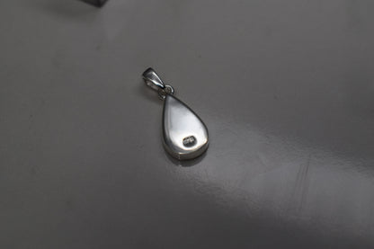 Handmade teardrop silver memorial ashes necklace with discreet ashes inlay, crafted in the UK