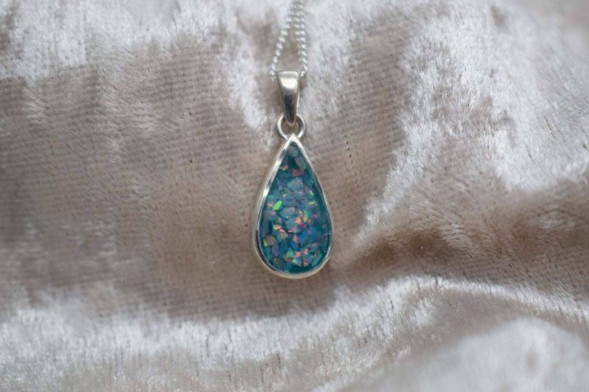 Handmade teardrop silver memorial ashes necklace with discreet ashes inlay, crafted in the UK