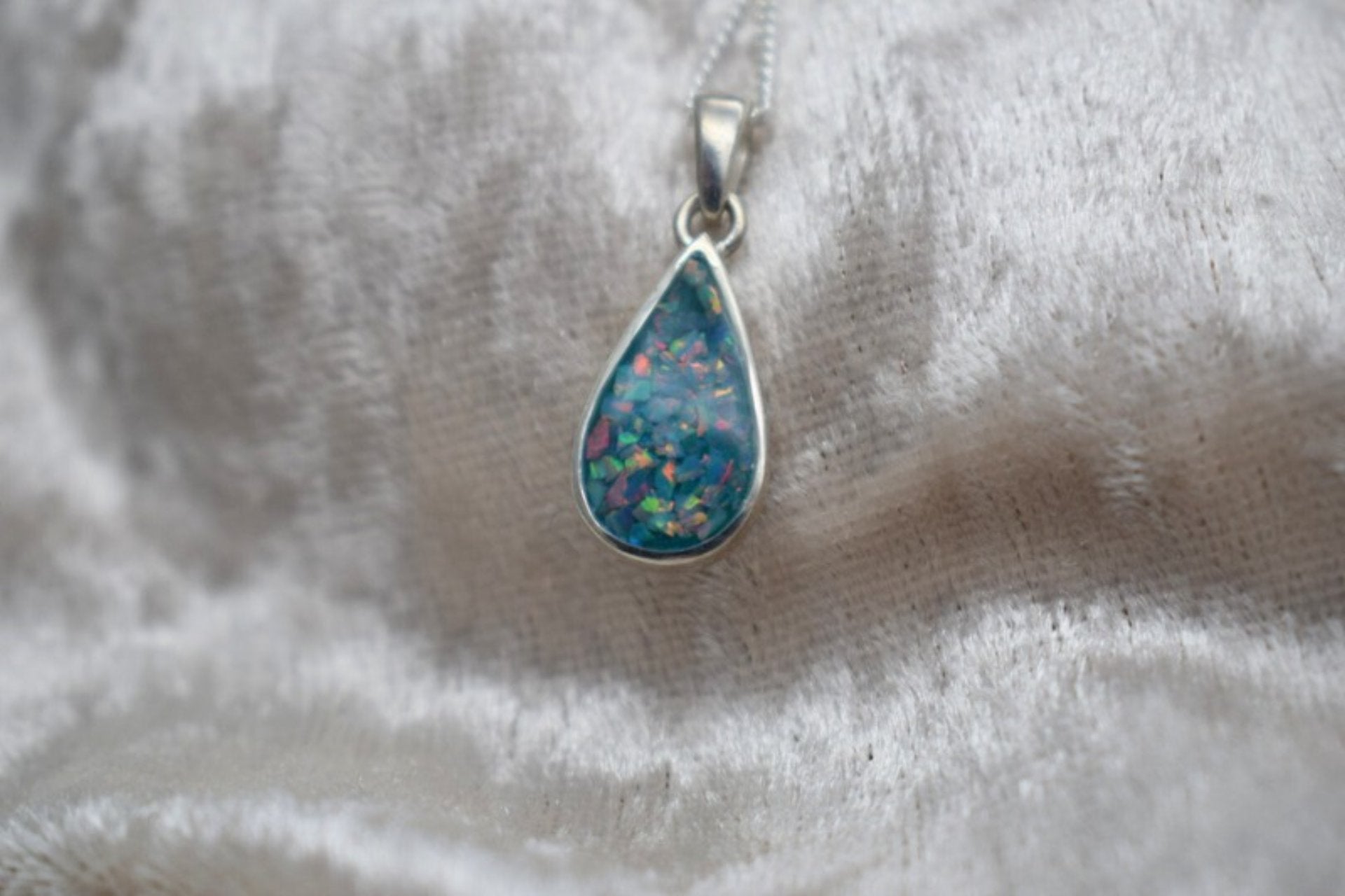 Handmade teardrop silver memorial ashes necklace with discreet ashes inlay, crafted in the UK