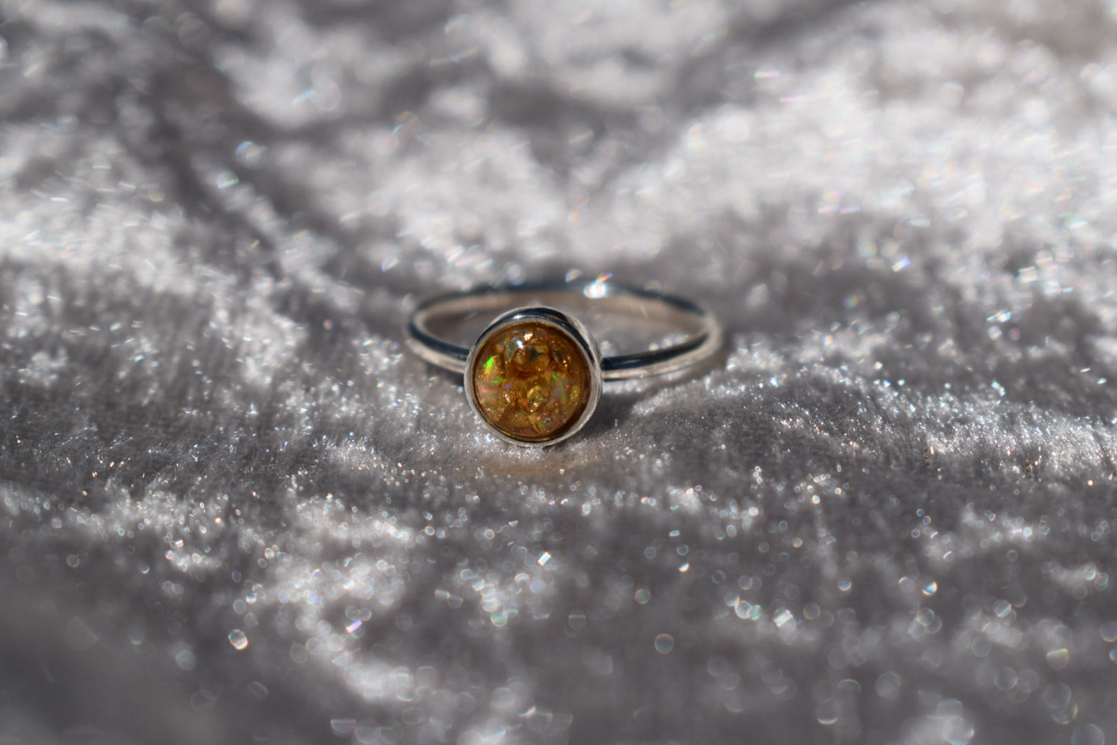 Handmade silver memorial ashes ring with a round setting. Personalised cremation jewellery crafted in the UK. Bespoke design, free engraving, and free UK shipping