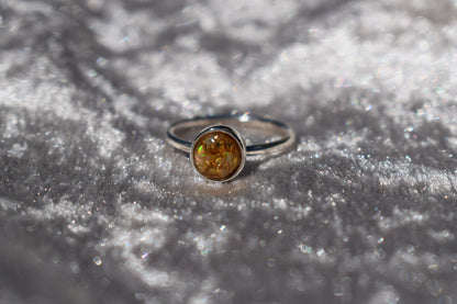 Handmade silver memorial ashes ring with a round setting. Personalised cremation jewellery crafted in the UK. Bespoke design, free engraving, and free UK shipping