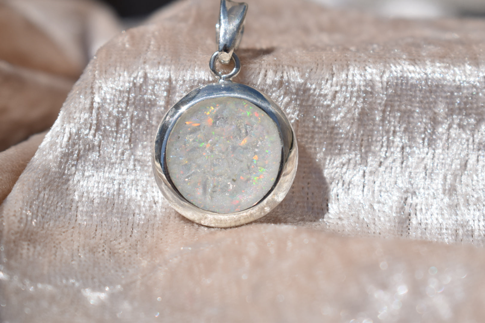 Large round silver cremation ashes necklace featuring a subtle and timeless design. Crafted from high-quality sterling silver, this handmade necklace preserves precious memories and offers a comforting keepsake. Designed in the UK, the necklace combines elegance and meaning, making it an ideal memorial jewellery piece.