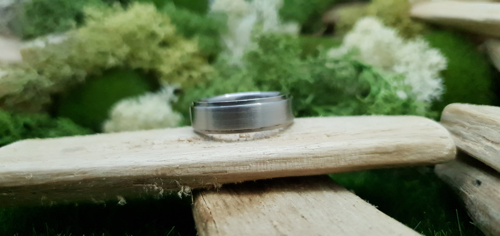 Smooth satin titanium wedding band for men in minimalist design
