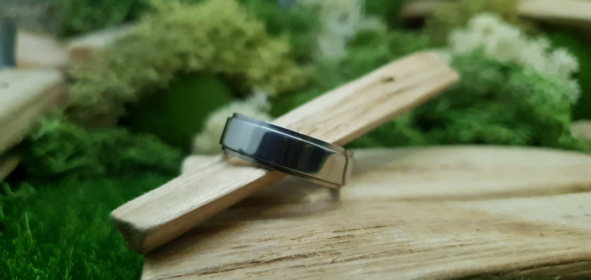 Sleek and modern titanium band with mirror finish and comfort fit